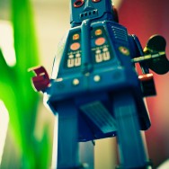 Robot standing in front of of a blurred backdrop