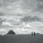 Kite on Hampstead Heath Two people walk on Hampsted Heath, a kite soars above.