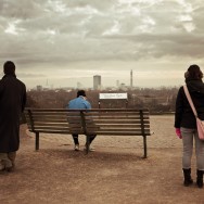 Three people looking into the distance.