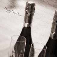 Two bottles of champaign and two glasses.