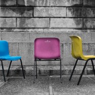 Three abandoned chairs in an Italian city.
