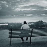 A man sitting on a bench.