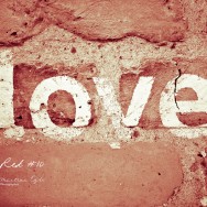 The words love painted onto a wall.
