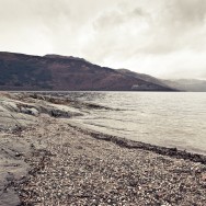 A shingle beach on Loch Lomond in Scotland.
