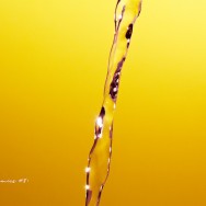 A stream of water over a yellow-orange backdrop