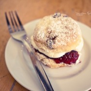 A scone on a white plate.