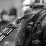 A woman has her curled in preparation for her wedding.