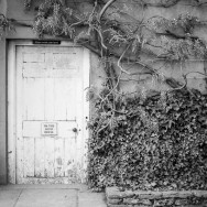 To The Bath House An old door with a sign "To The Bathouse"