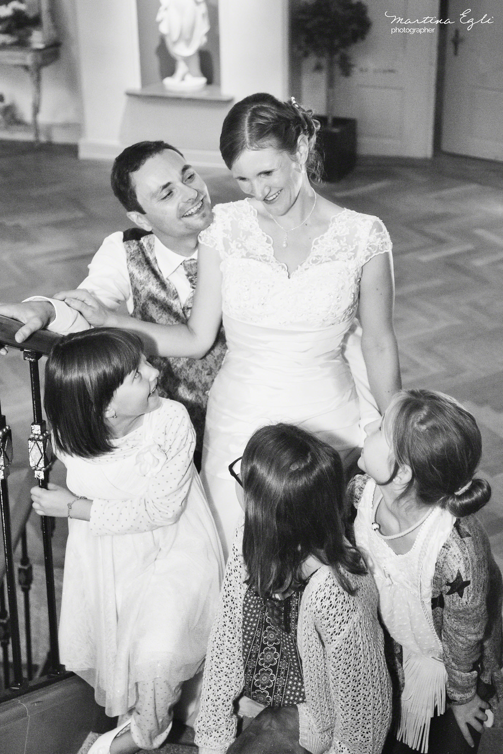 A Bride and Groom on the stairs at their reception