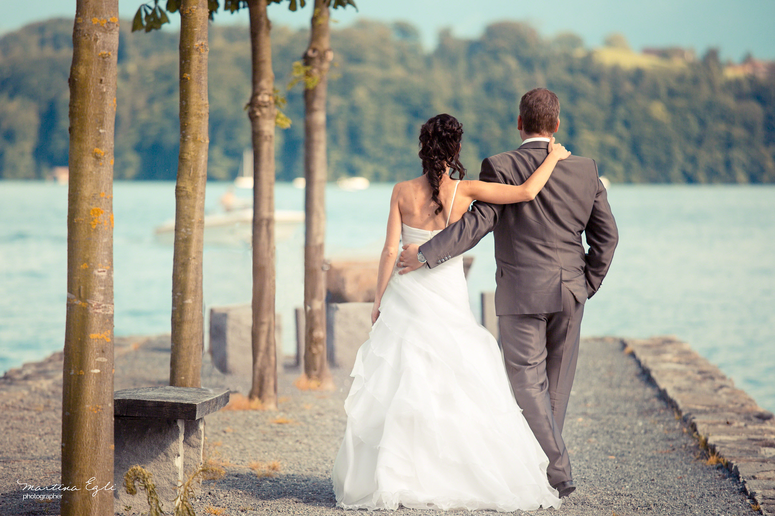 A Bride and Groom walk arm in arm