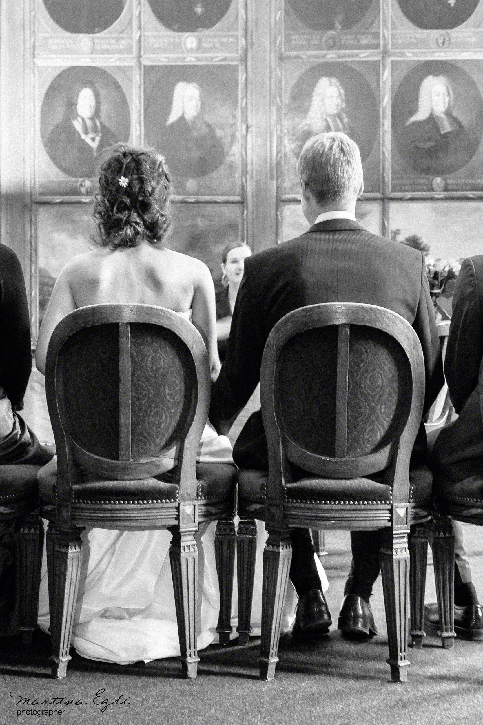 A Bride and Groom seated at their ceremony