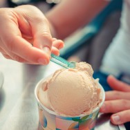 Digging into a tub of ice cream