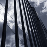 Blue Image of clouds reflected in a glass building