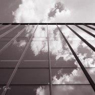 Red Image of clouds reflected in a glass building