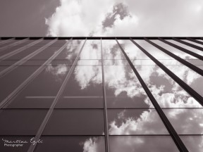 Red Image of clouds reflected in a glass building