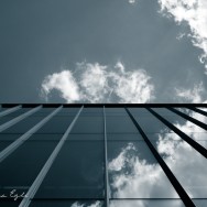 Blue Image of clouds reflected in a glass building