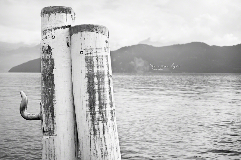 Two mooring posts on lake Luzern in Switzerland.