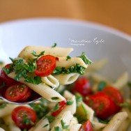 A spoon full of Caprese pasta