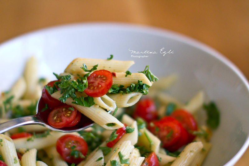 A spoon full of Caprese pasta