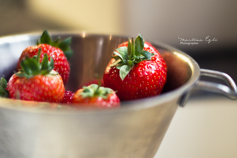 Strawberry in a sieve.