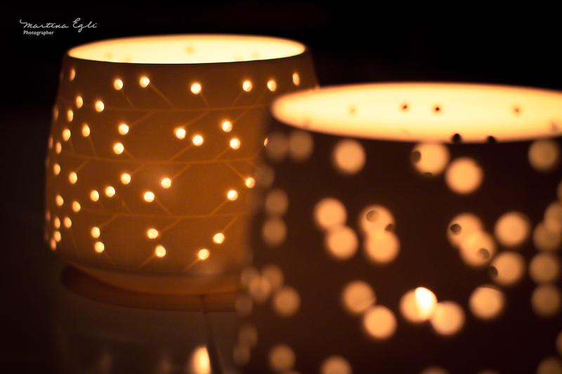 Candle holders illuminated from within.