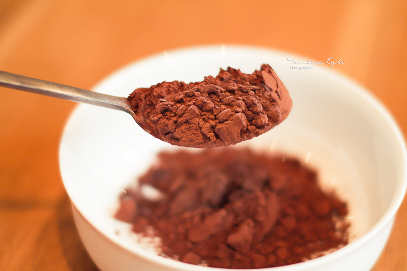 A spoon full of cacao powder.