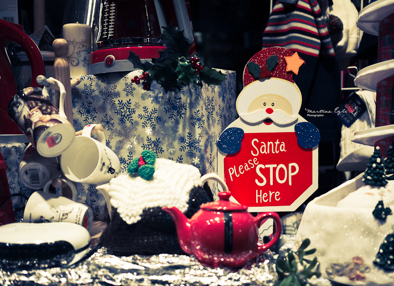 A christmas window display with a santa.