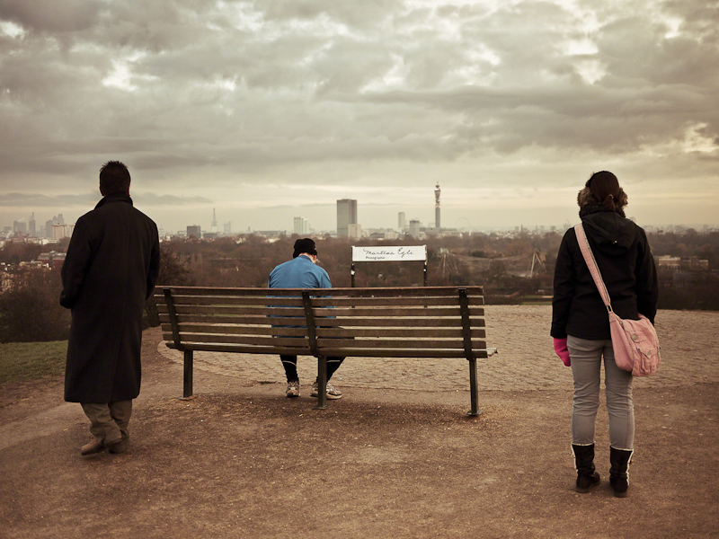 Three people looking into the distance.