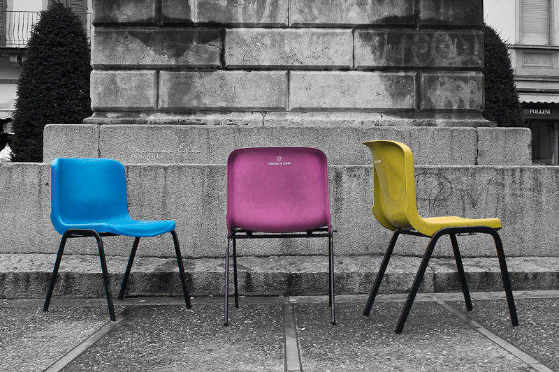 Three abandoned chairs in an Italian city.