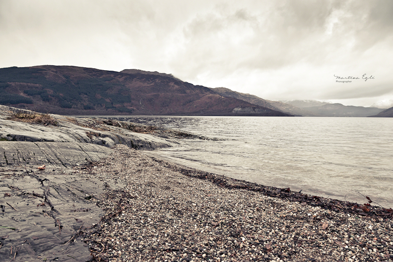 A shingle beach on Loch Lomond in Scotland.