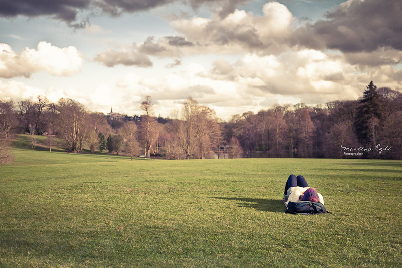 A women sunbathing with no sun.