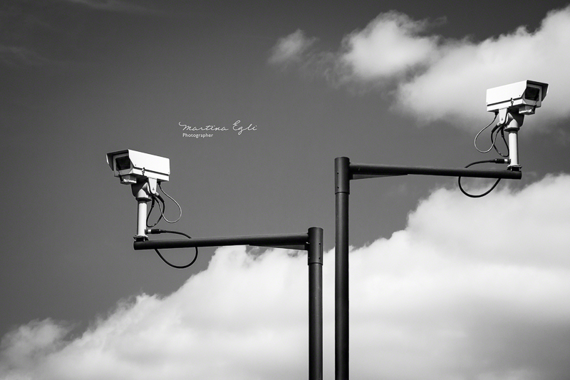 Two CCTV cameras in the streets of London.