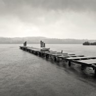 A jetty over Loch Lomond in stormy weather.