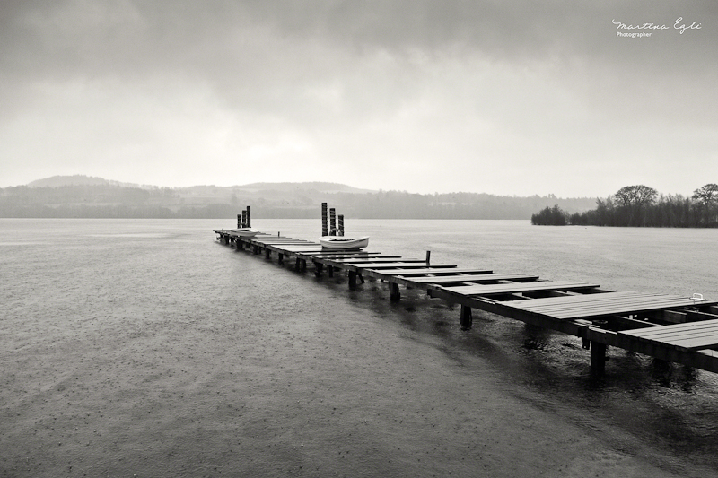 A jetty over Loch Lomond in stormy weather.