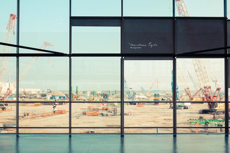 A major building site in London take through a series of square windows.