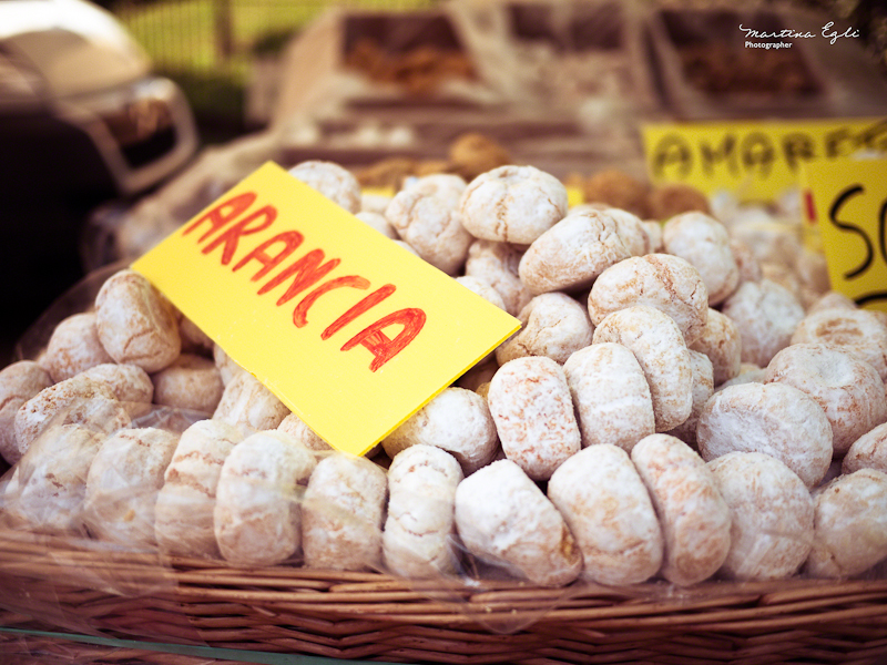 A basket of amaretti at a farmers market.