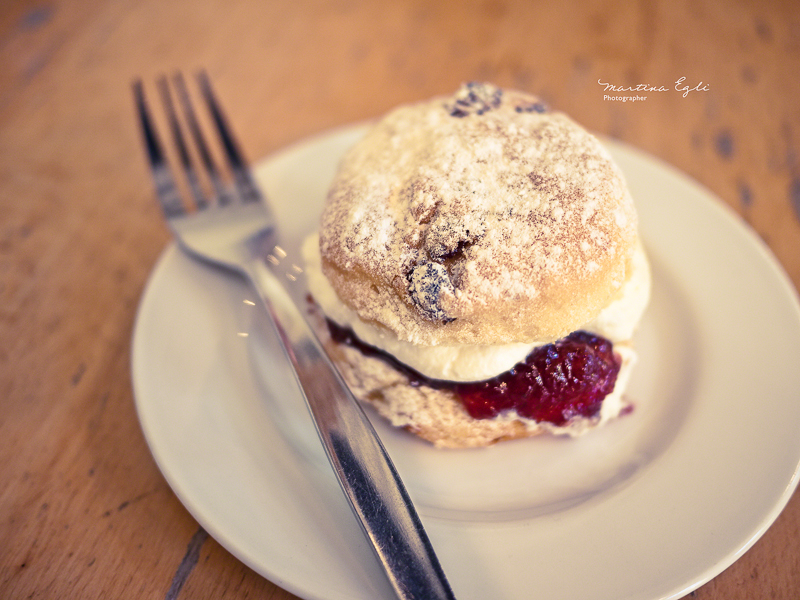 A scone on a white plate.