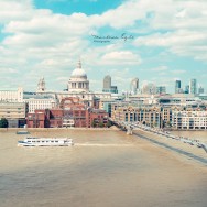 Skyline of London with St. Paul's Cathedral and Millenium Bridge.